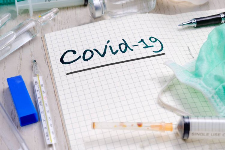 Covid-19 text on notebook with medical equipments, knowledge for coronavirus or covid-19 pandemic concept